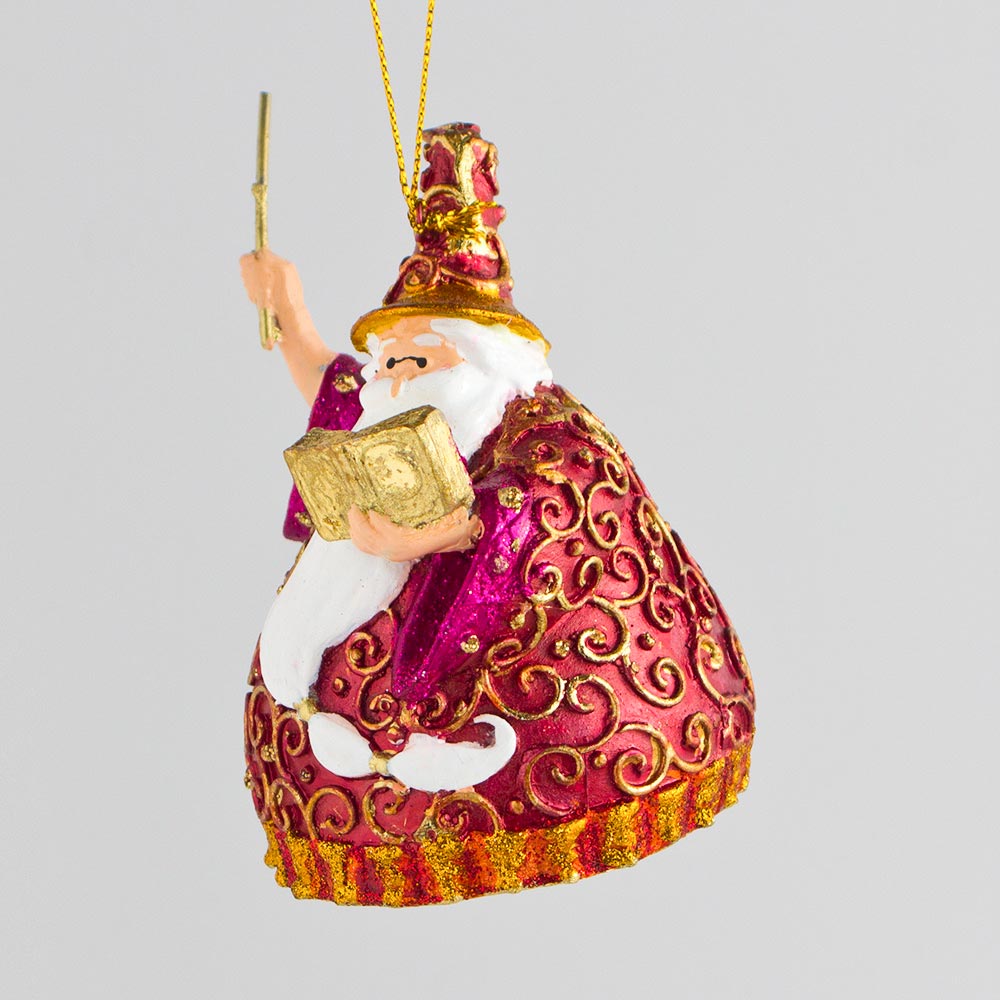 Weihnachtsmann mit Zauberstab und Buch